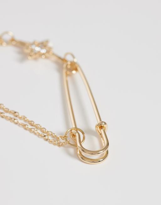 ASOS DESIGN – Guldfärgad brosch med säkerhetsnål och hängande stjärna, 2 av 3