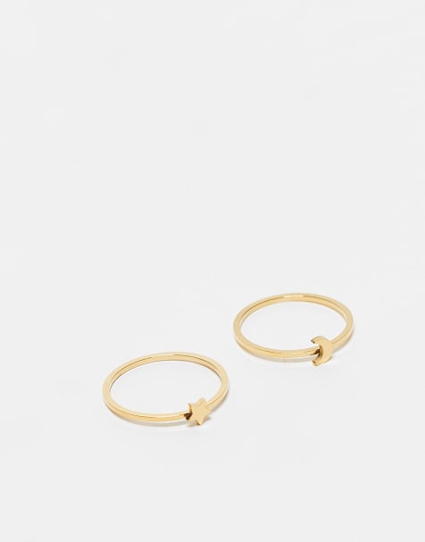 ASOS DESIGN – Guldfärgade ringar med stjärna och måne i vattentåligt, rostfritt stål i 2-pack som kommer i en presentpåse - view 1