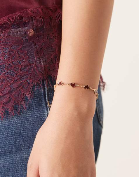 ASOS DESIGN – Guldfärgat armband med vinrött emaljerade hjärtan - view 1