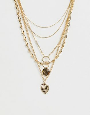 ASOS DESIGN – Guldfärgat halsband med flera kedjor och mynt- och hjärtsmycken i vintagestil