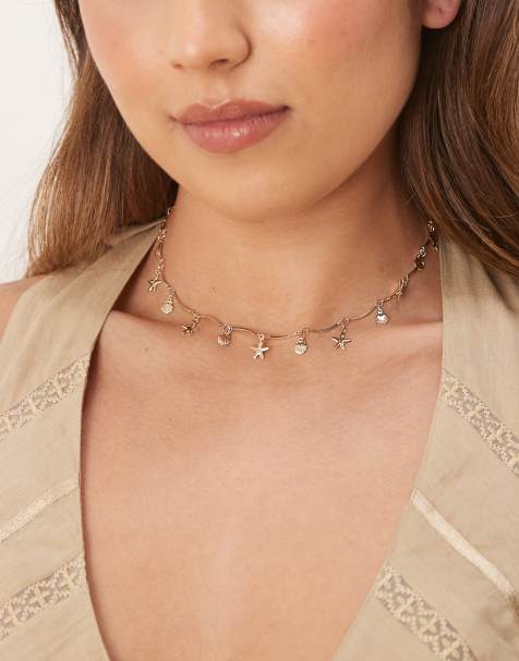 ASOS DESIGN – Guldfärgat kort halsband med vågig design och små havsdjur - view 1