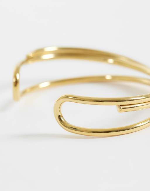 ASOS DESIGN - Guldfarvet armbånd i vandtæt rustfrit stål med krydsende design, 2 af 3