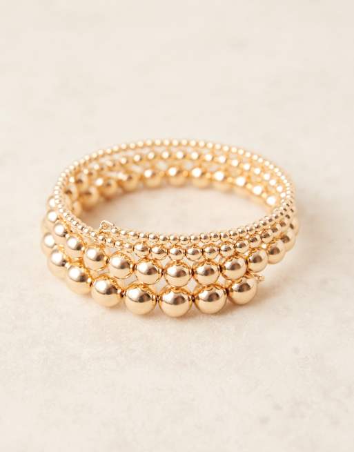 ASOS DESIGN - Guldfarvet slå-om-armring med kugledesign, 2 af 3
