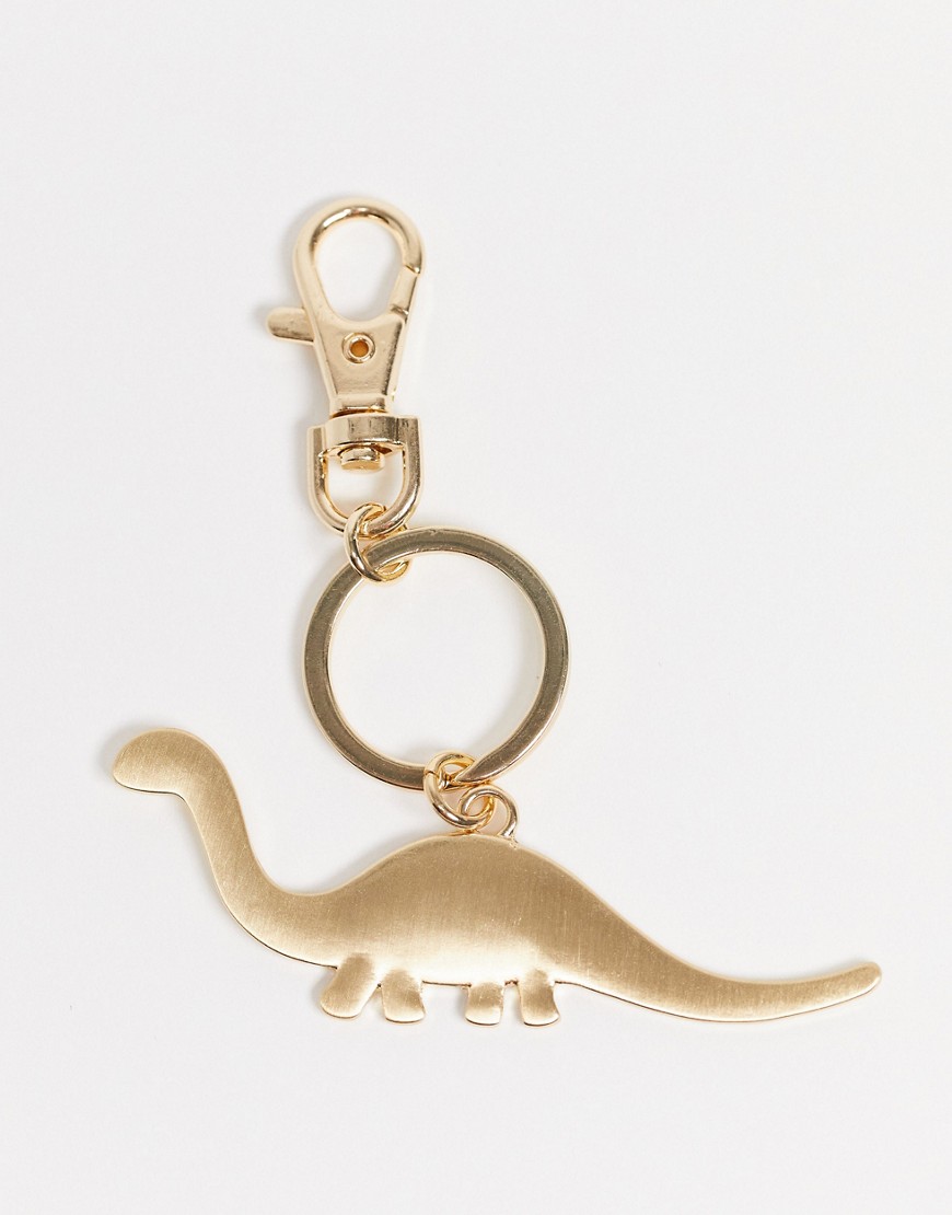 ASOS DESIGN - Guldfarvet taskevedhæng med dinosaur-design