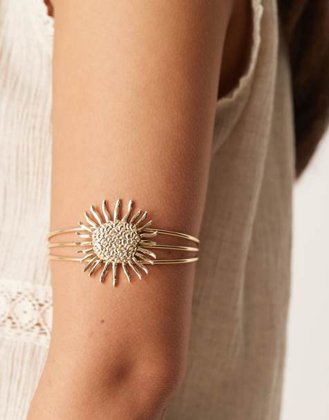 ASOS DESIGN – Guldpläterat, stelt armband med emaljerad sol - view 1