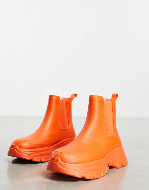 ASOS DESIGN gumboots in bright orange