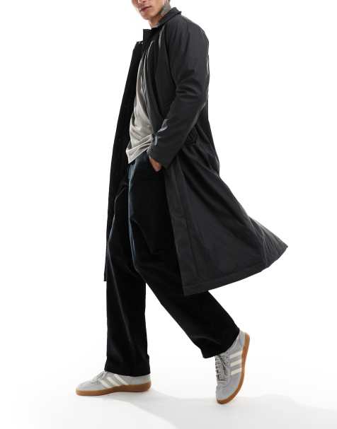 ASOS DESIGN – Gummierter Trenchcoat in Schwarz - view 1