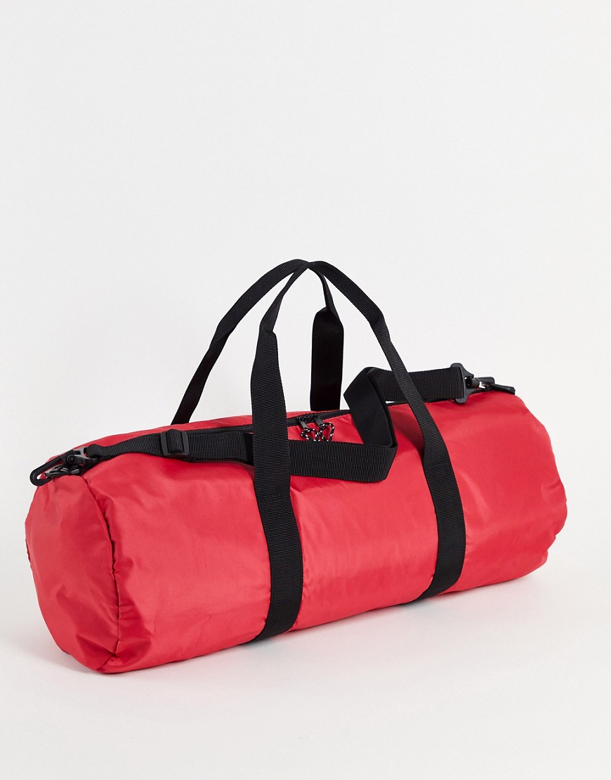 ASOS DESIGN gym barrel bag in red nylon with shoulder strap 37 Liter