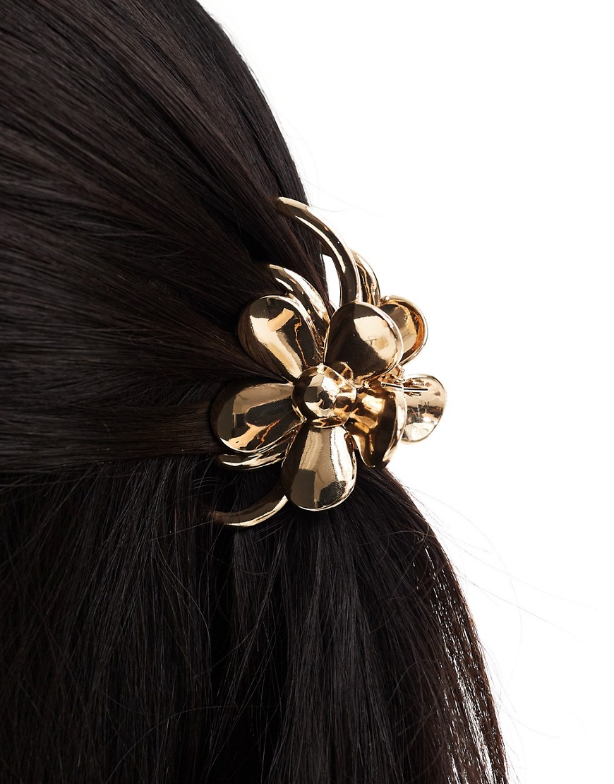 hair claw with floral detail in gold tone