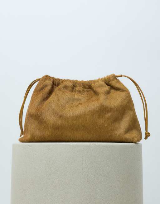 ASOS DESIGN hair on leather  drawstring pouch clutch bag with detachable strap in chartreuse, 2 of 5
