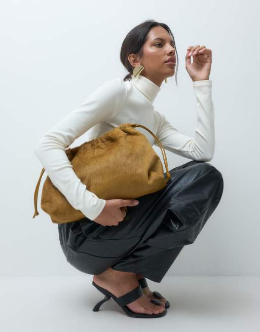 ASOS DESIGN hair on leather  drawstring pouch clutch bag with detachable strap in chartreuse, 3 of 5