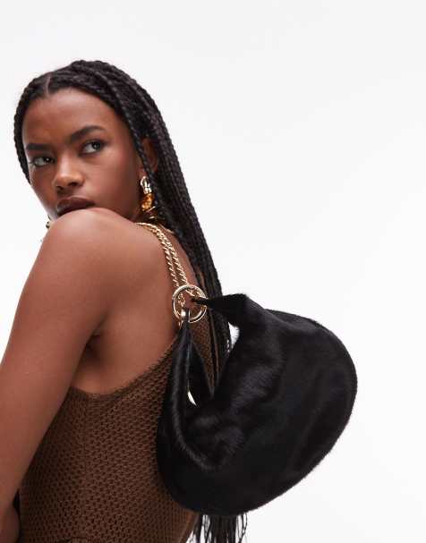 ASOS DESIGN hair on real leather  pouch clutch with gold hardware in black - view 1