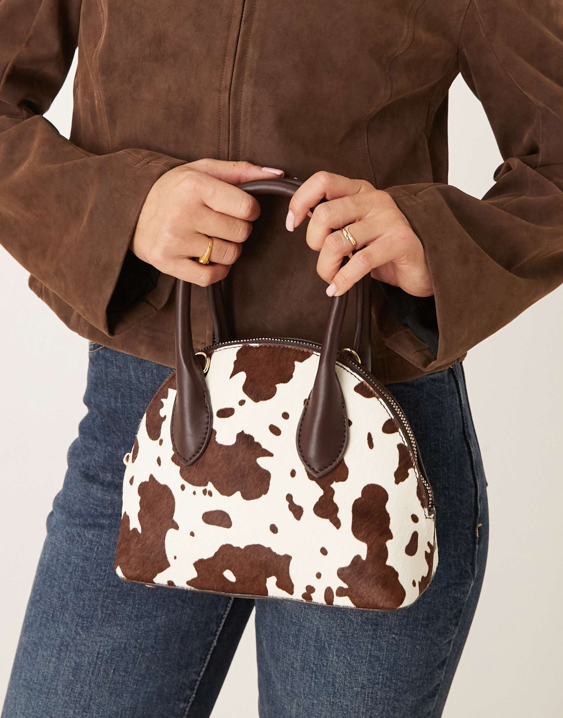 asos design hair on real leather with cow print grab bowler bag with detachable crossbody strap