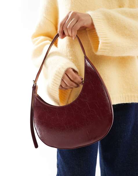 ASOS DESIGN – Halbmondförmige Schultertasche in Burgunderrot mit asymmetrischem Design und Schnalle - view 1