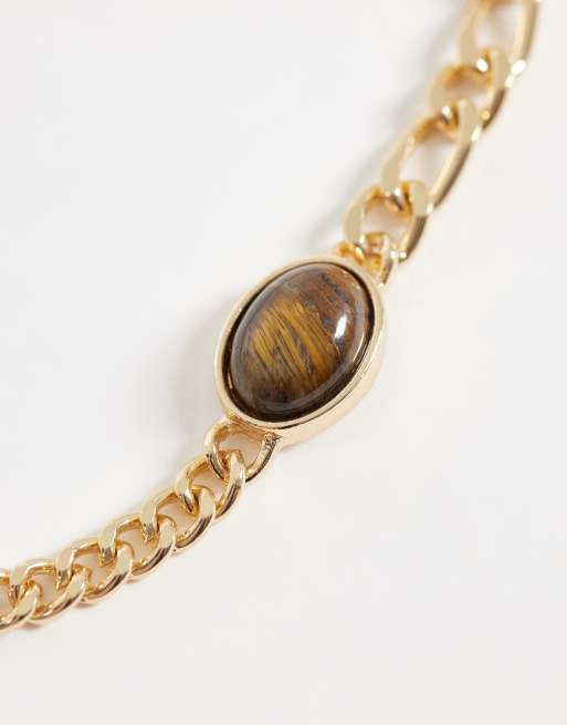 ASOS DESIGN half and half tijgeroog schakelarmband in goud, 2 van 3