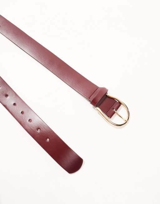 ASOS DESIGN half moon waist and hip jeans belt in burgundy