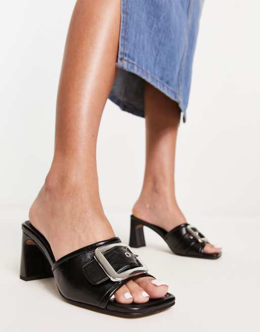 ASOS DESIGN Halfway buckle detail mid heeled mules in black ASOS