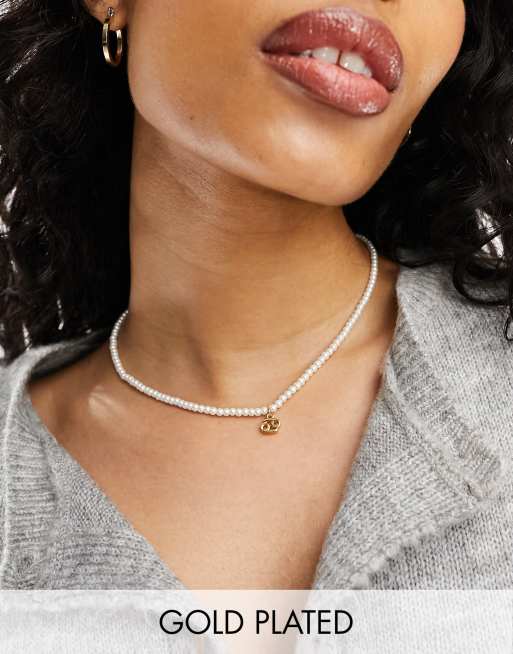 ASOS DESIGN - Halskæde i 14k guldbelægning med glasperler, Krebsen-vedhæng og gavepose