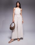 [ASOS DESIGN] ASOS DESIGN halter asym overlay detail jumpsuit in stone-Neutral 6 STONE