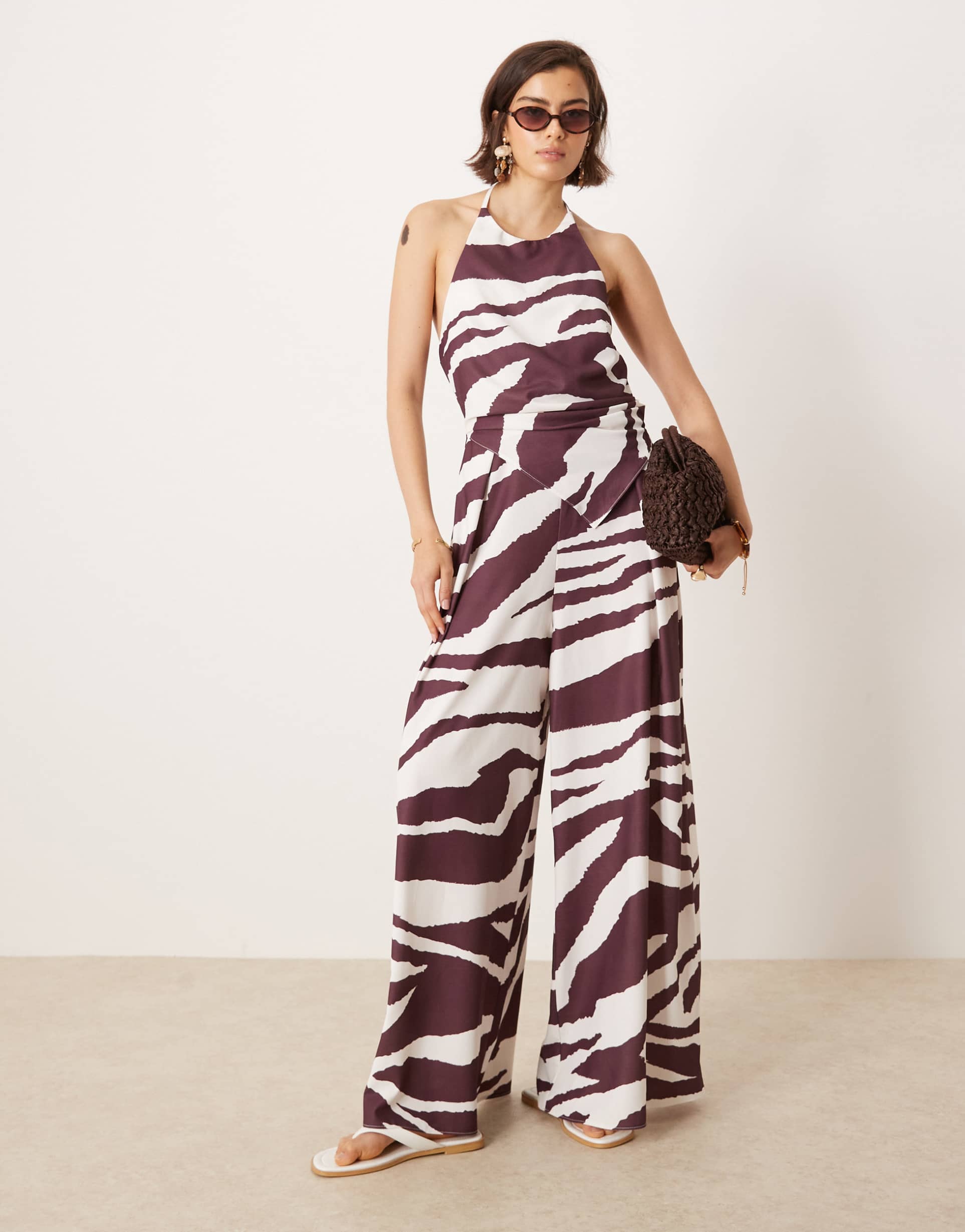 ASOS DESIGN halter asym overlay detail jumpsuit in zebra print