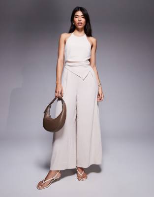 halter asymmetric overlay detail jumpsuit in stone-Neutral