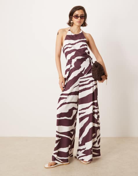 ASOS DESIGN halter asymmetric overlay detail jumpsuit in zebra print - view 1