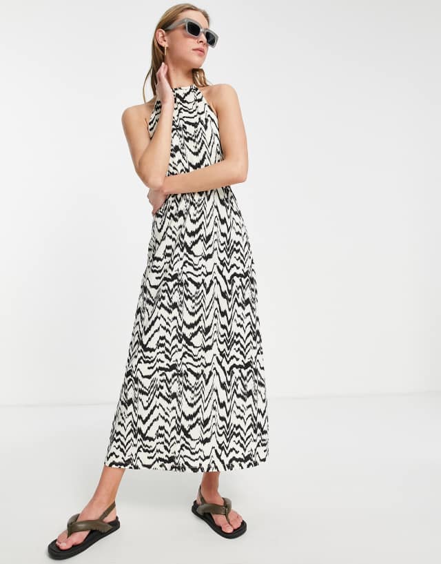 ASOS DESIGN halter maxi dress with open back in animal aztec print