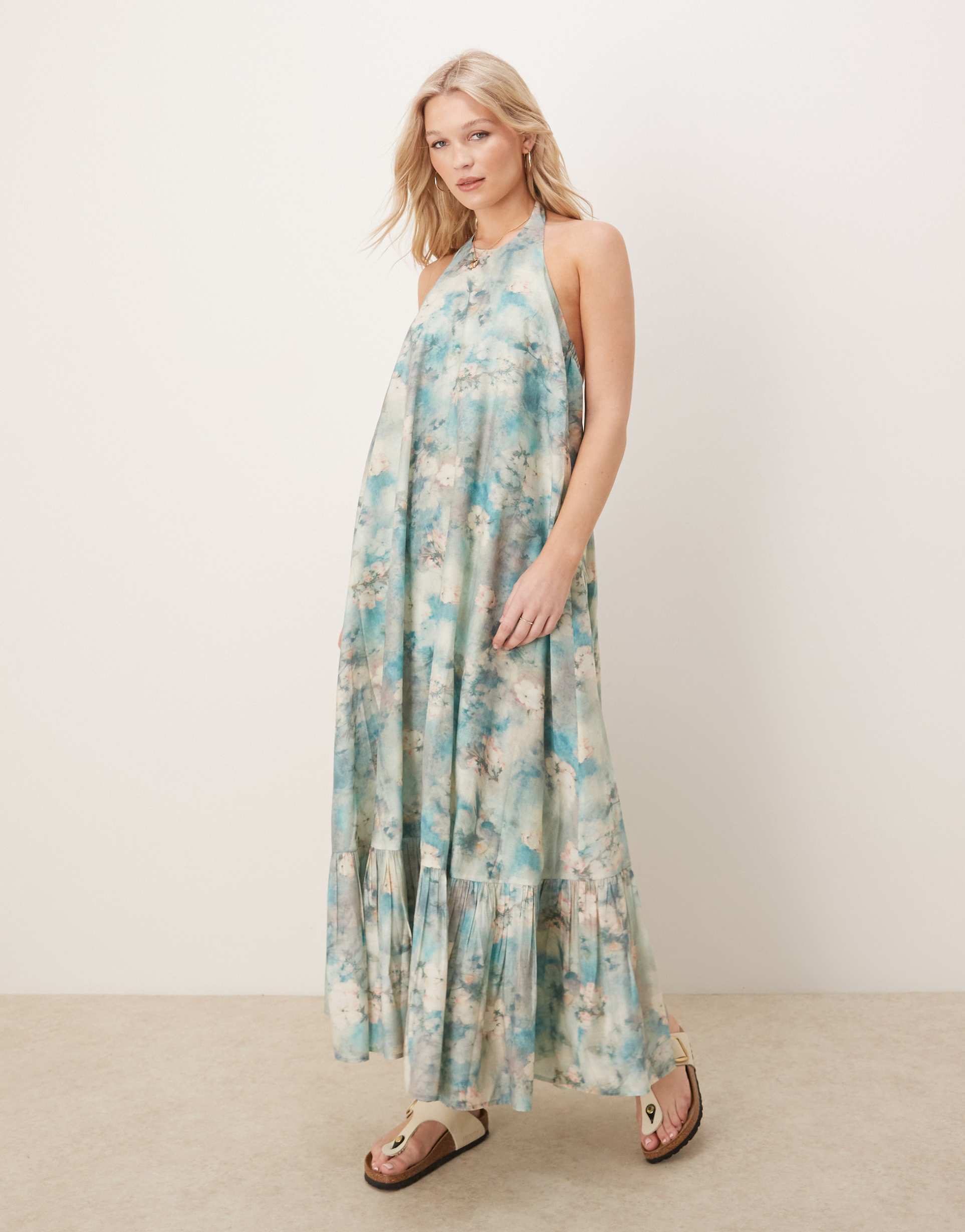 asos design halter maxi dress with ruffle hem in blurred floral print