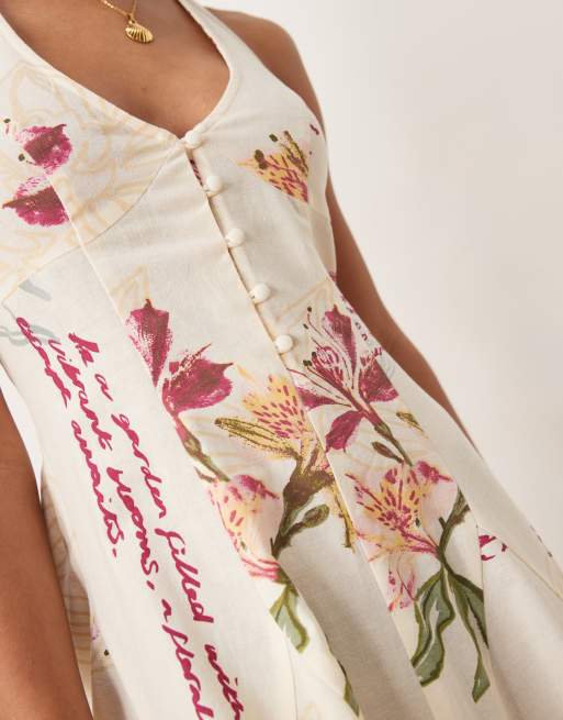 ASOS DESIGN halter mini dress with godet hem in rose conversational print