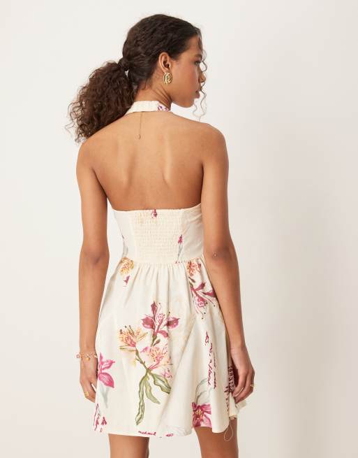ASOS DESIGN halter mini dress with godet hem in rose conversational print