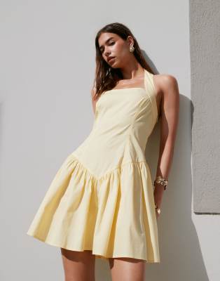 ASOS DESIGN halter mini dress with ruffle hem in lemon
