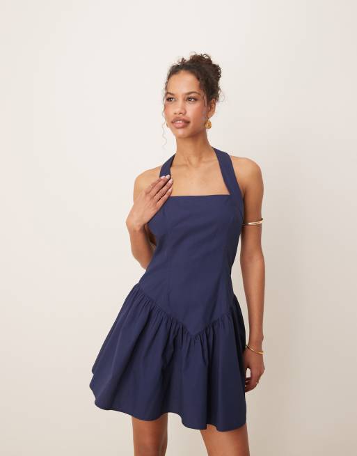ASOS DESIGN halter mini dress with ruffle hem in navy