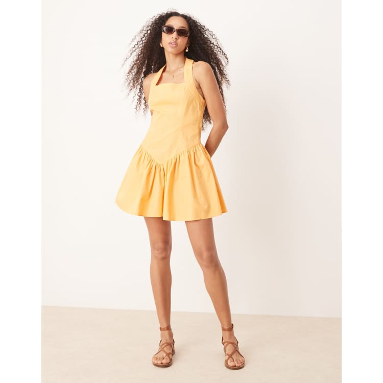 ASOS DESIGN halter mini dress with ruffle hem in tangerine