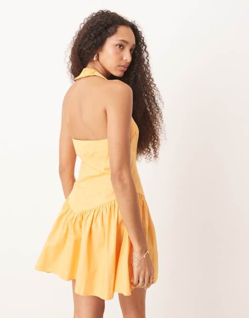 ASOS DESIGN halter mini dress with ruffle hem in tangerine