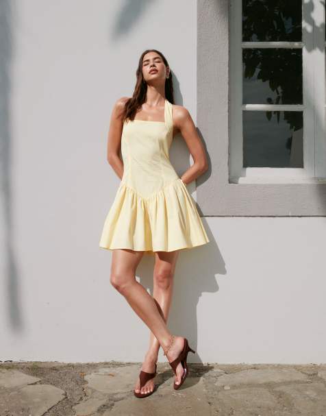 ASOS DESIGN halter mini sundress with ruffle hem in lemon - view 1