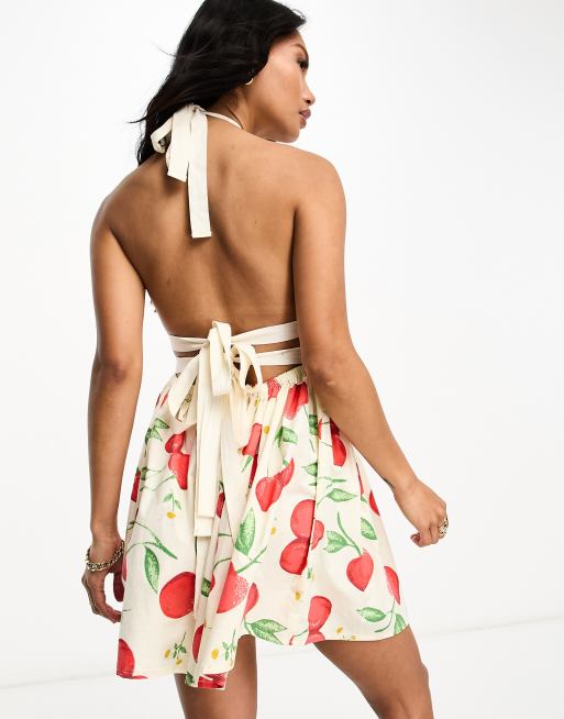 ASOS DESIGN halter mini sundress with strappy back in cherry print