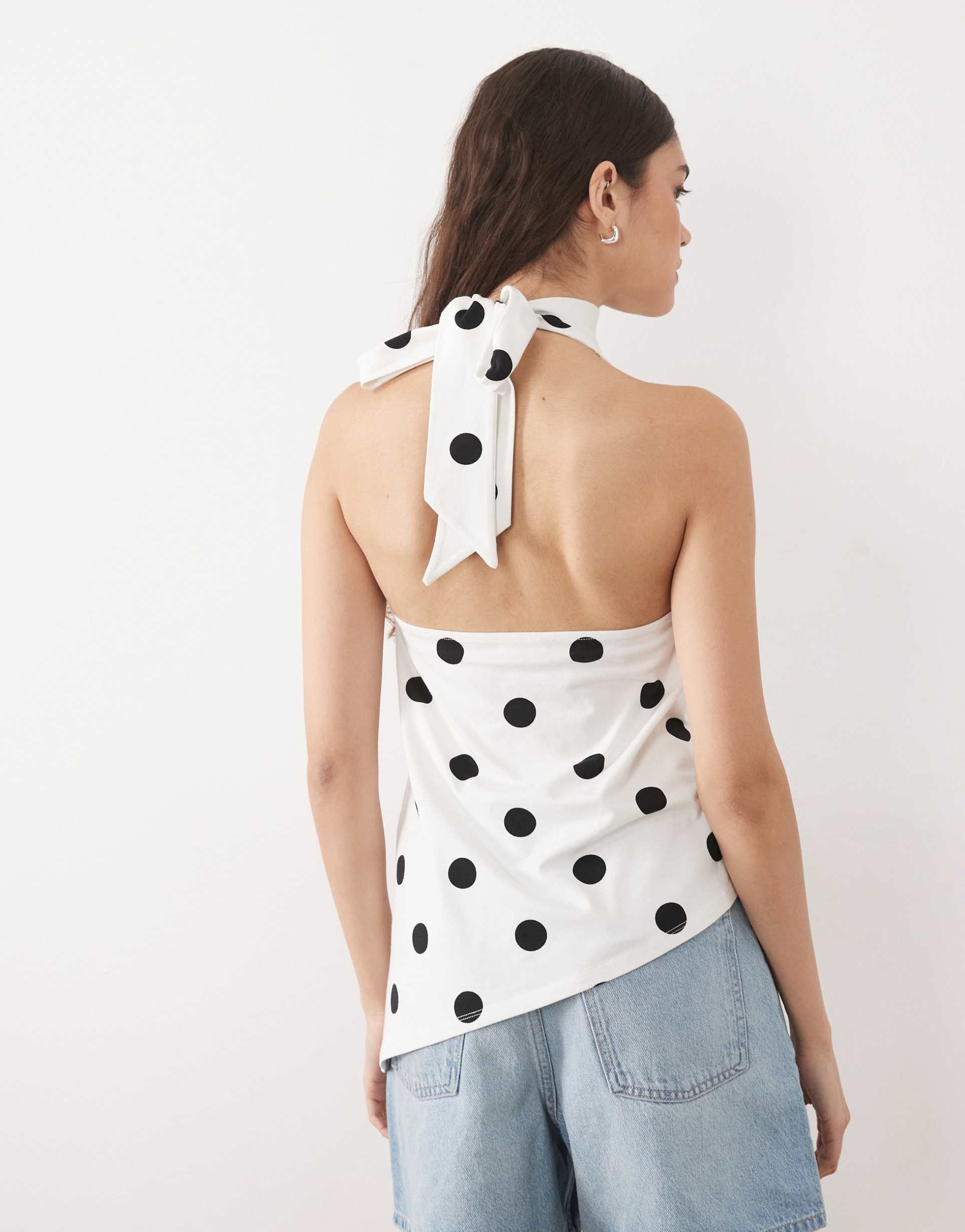 asos design halter neck asymmetric top in buttermilk and black polka dot