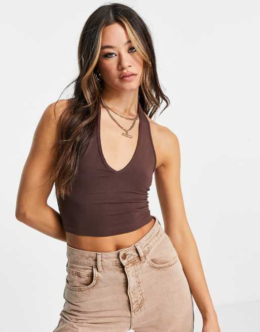 ASOS DESIGN halter cross neck crop top with button detail in light gold