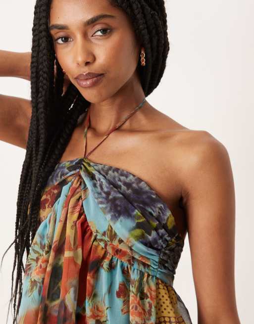 ASOS DESIGN halter neck mini dress with contrast hem in patchwork print