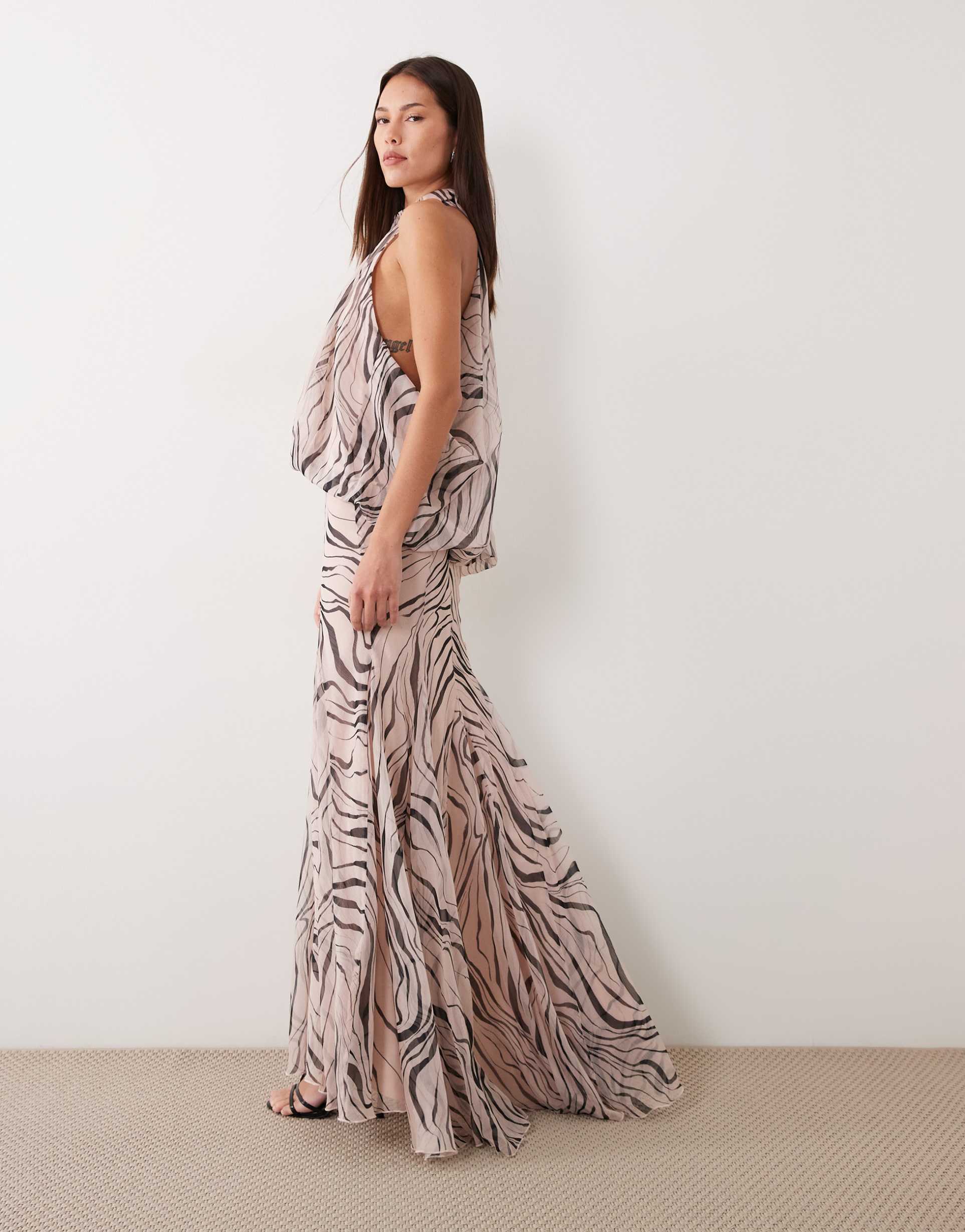 asos design halter neck slouchy dropped waist godet maxi dress in abstract zebra