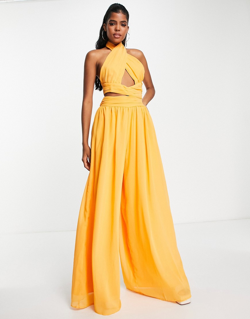 ASOS DESIGN halter ruched jumpsuit with cut out in marigold-Yellow