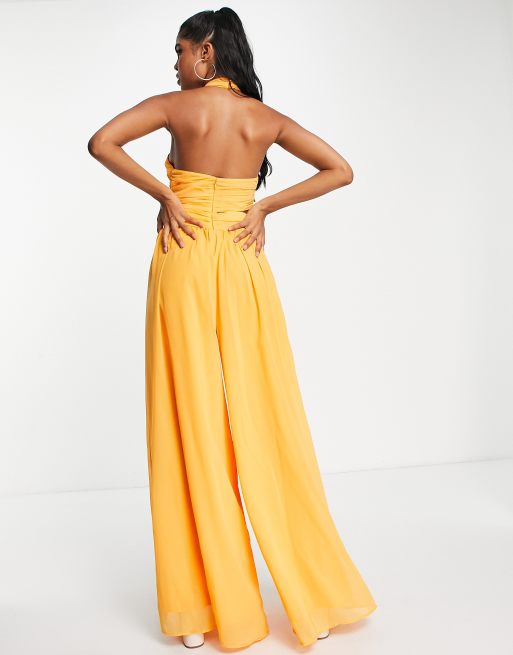 ASOS DESIGN halter ruched jumpsuit with cut out in marigold