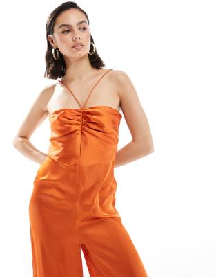 ASOS DESIGN halter tie ruched front straight leg satin jumpsuit in rust-Red