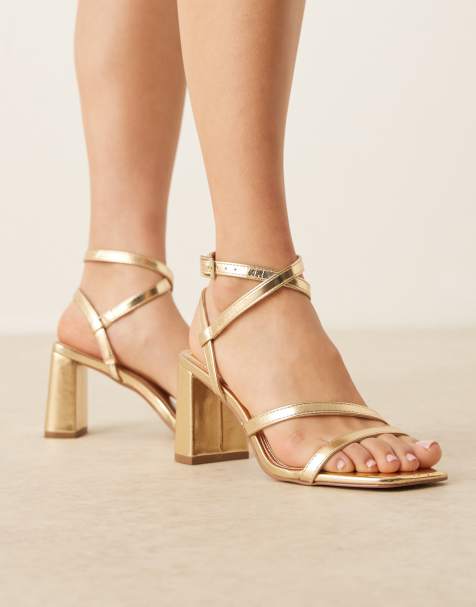 ASOS DESIGN Hampstead mid heeled sandals in gold - view 1