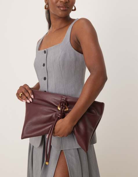 ASOS DESIGN hardware detail wrap flap clutch bag in burgundy - view 1