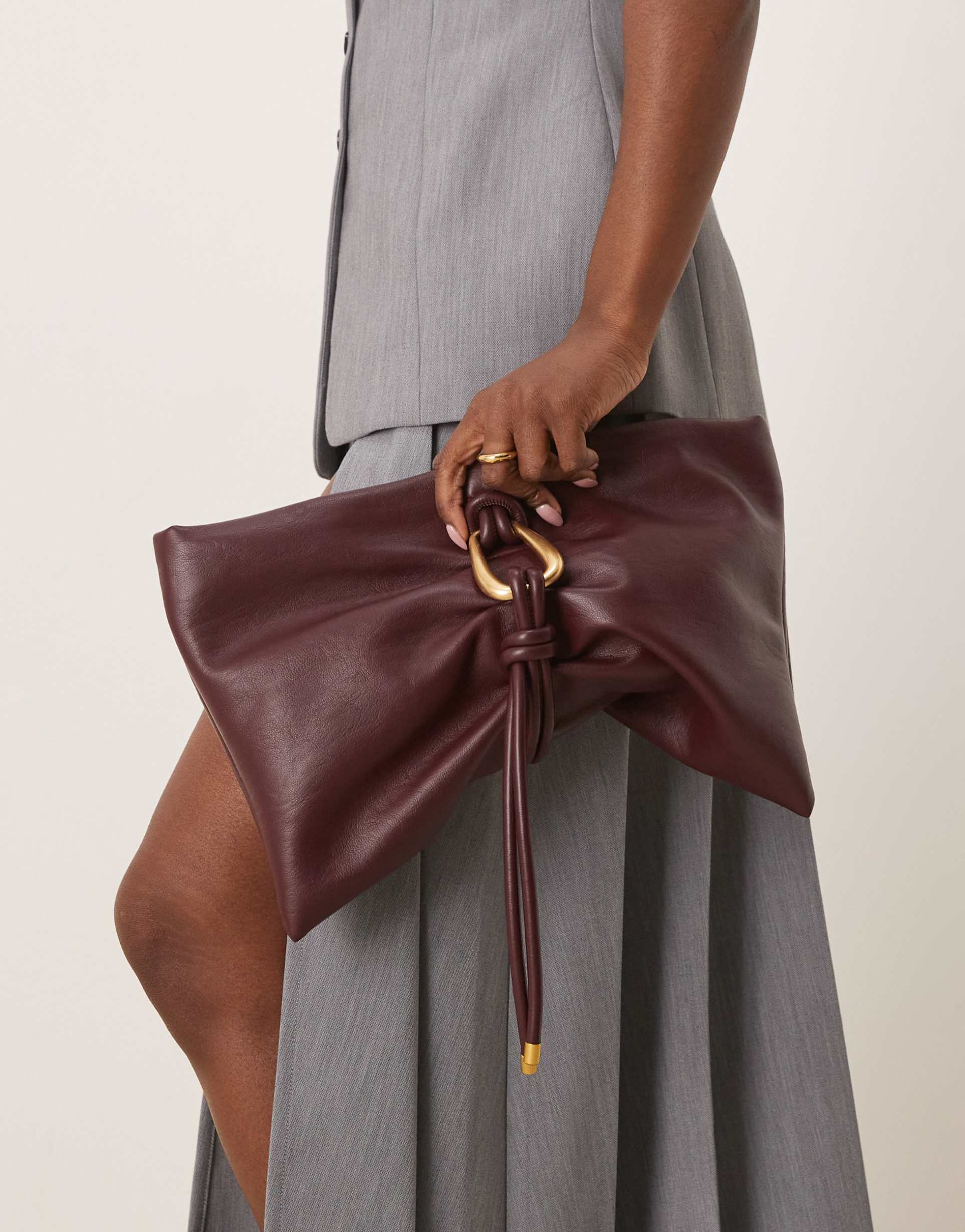 asos design hardware detail wrap flap clutch bag in burgundy