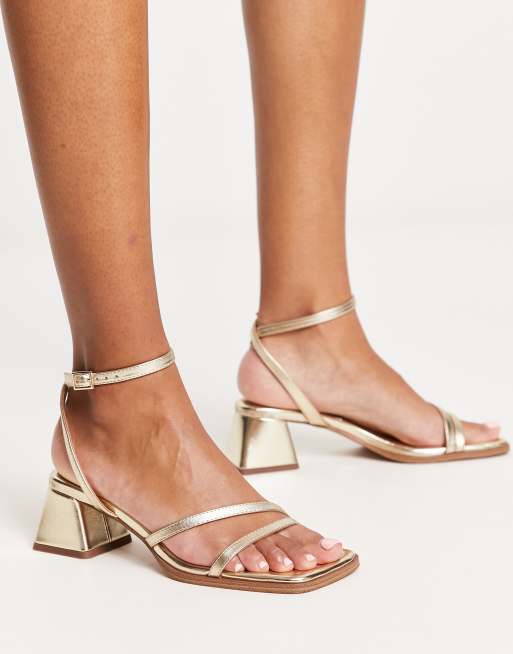 Low block deals gold heels