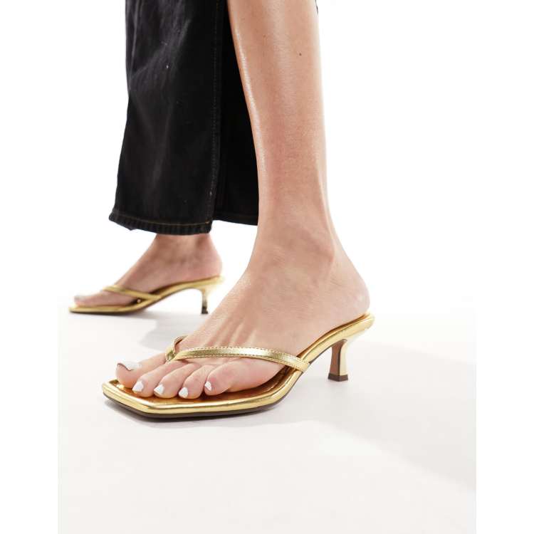 ASOS DESIGN Heatwave toe thong kitten heeled sandals in gold | ASOS