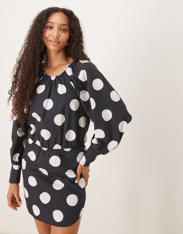 ASOS DESIGN heavy poplin blouson mini dress with tie back in black polka dots