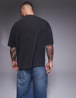ASOS DESIGN boxy oversized T-shirt in heavyweight 220gsm washed charcoal with text graphic and pocket detail